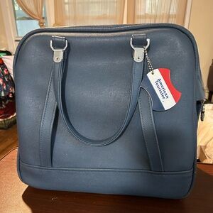 Vintage American Tourister tiara  med. Blue weekender bag quilted floral lining.